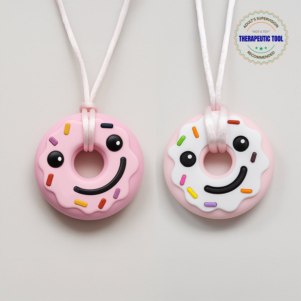 Ableys pastel donut chewable necklaces for sensory needs pink and white smiling donut pendant on adjustable white cords