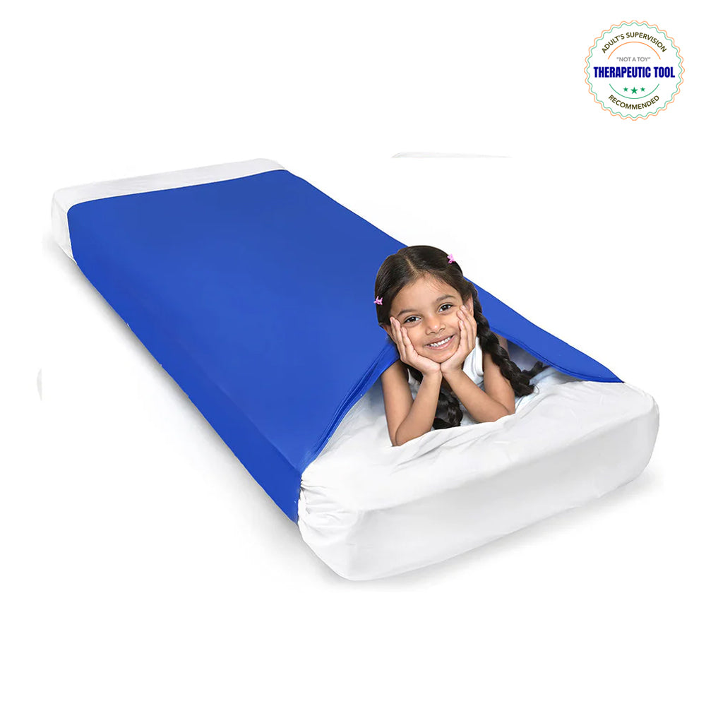 Ableys blue compression bed sheet for sensory needs on white mattress with smiling child