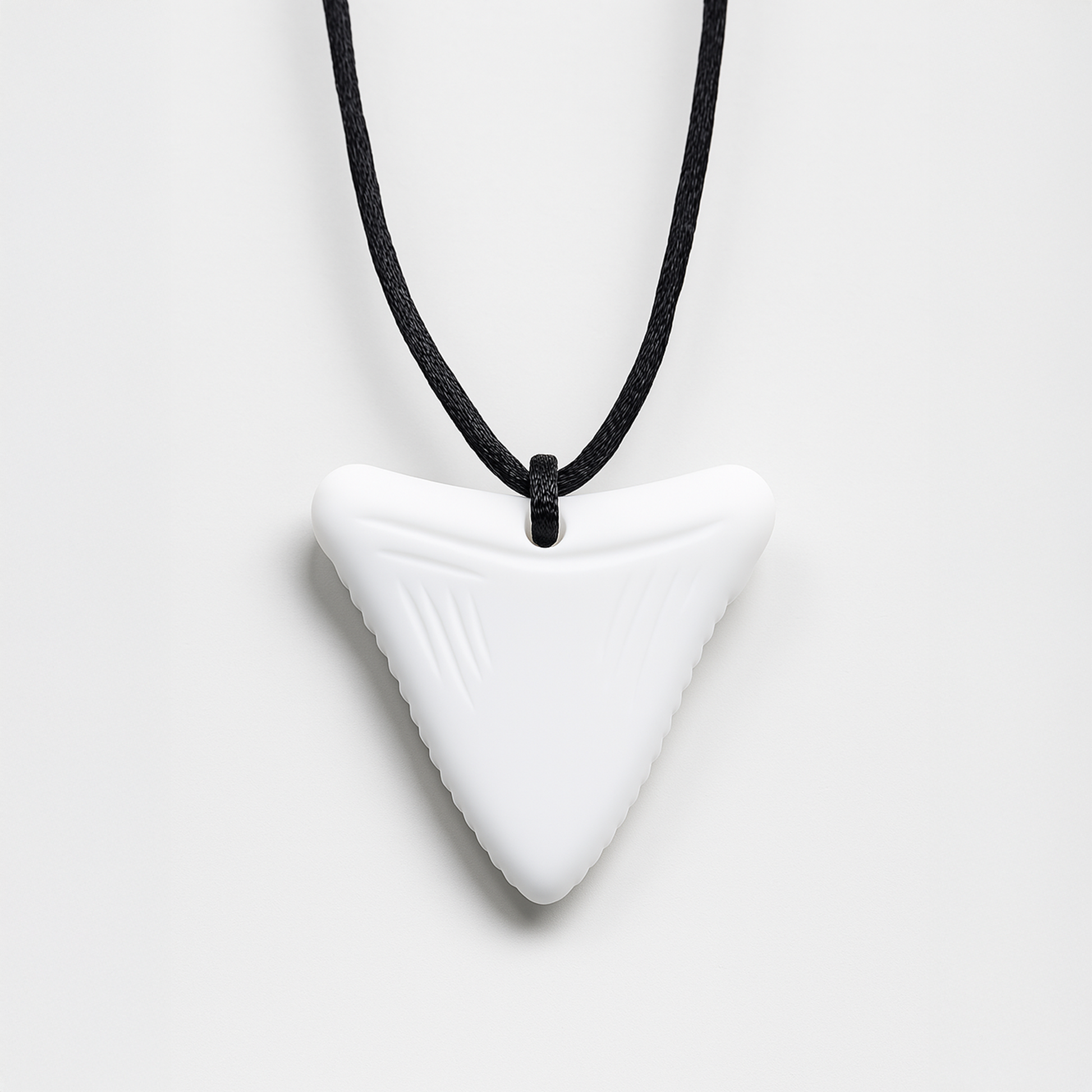 Ableys white triangular silicone chewable necklace for sensory needs on black cord with textured edges