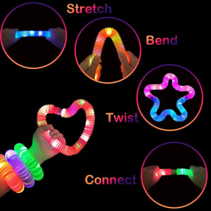 Colorful LED pop tubes sensory toys being stretched bent and twisted into shapes and bracelets by hands