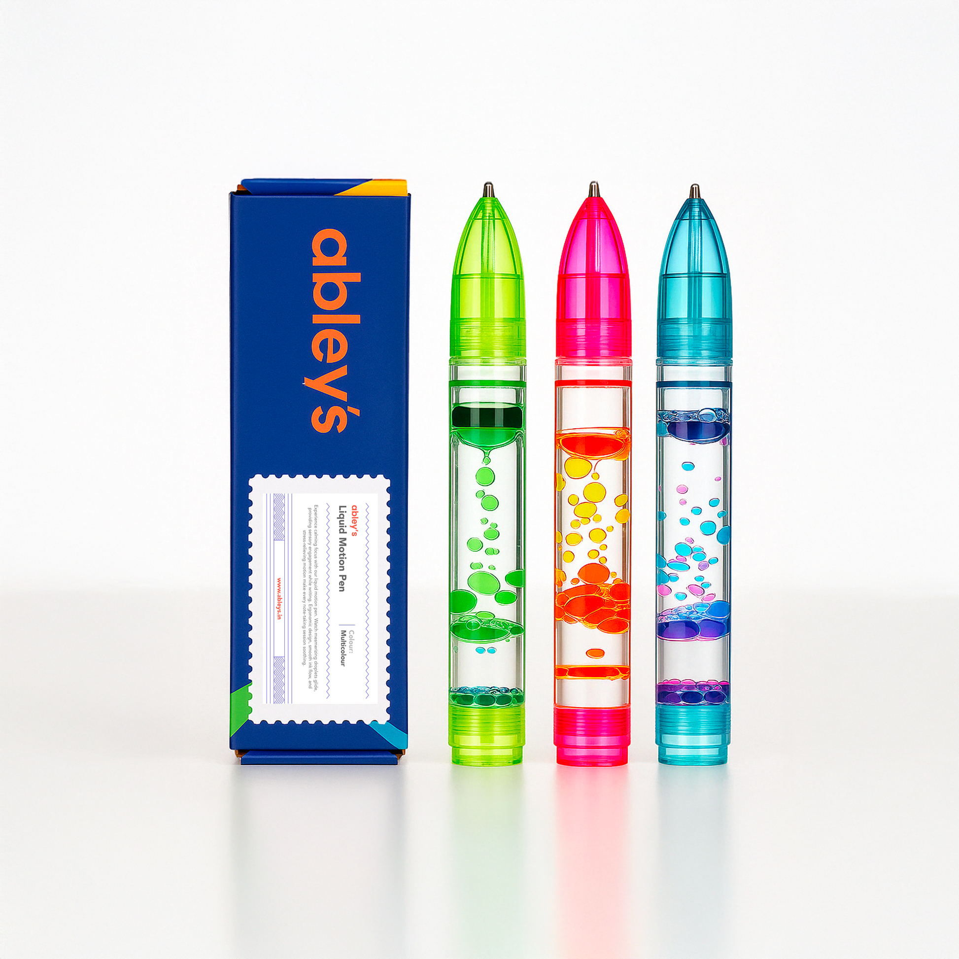 Ableys three colorful liquid motion pens with floating bubbles next to blue box liquid motion pen fidget for anxiety