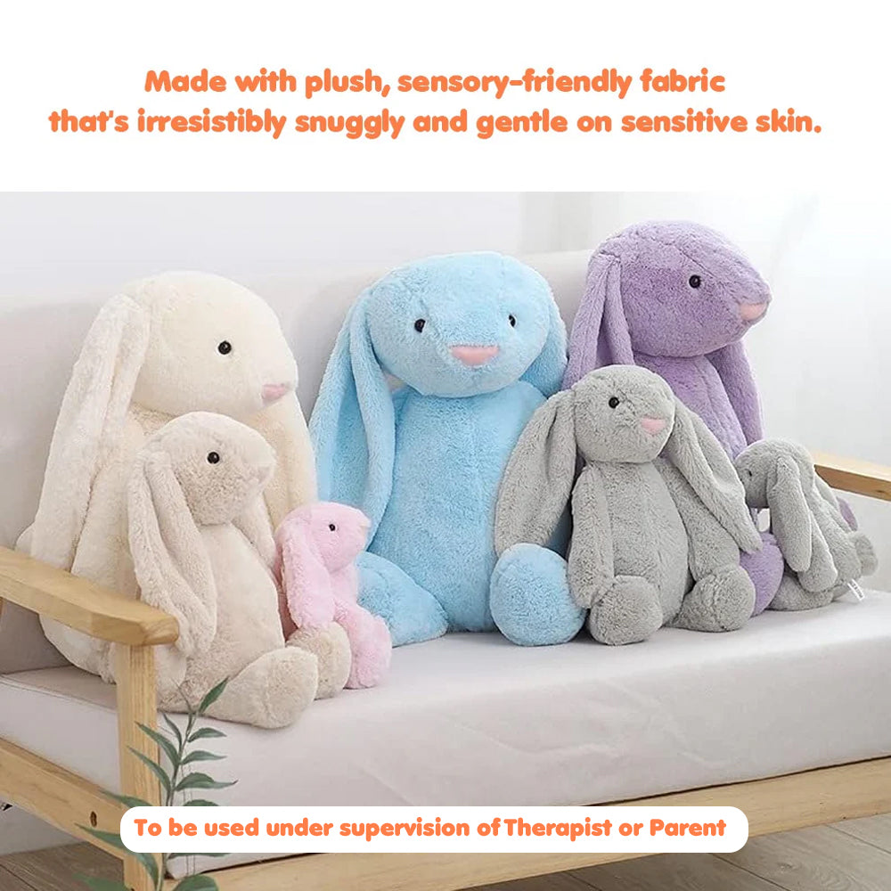 Ableys pastel plush bunnies in multiple sizes on a couch weighted plush bunny for sensory therapy
