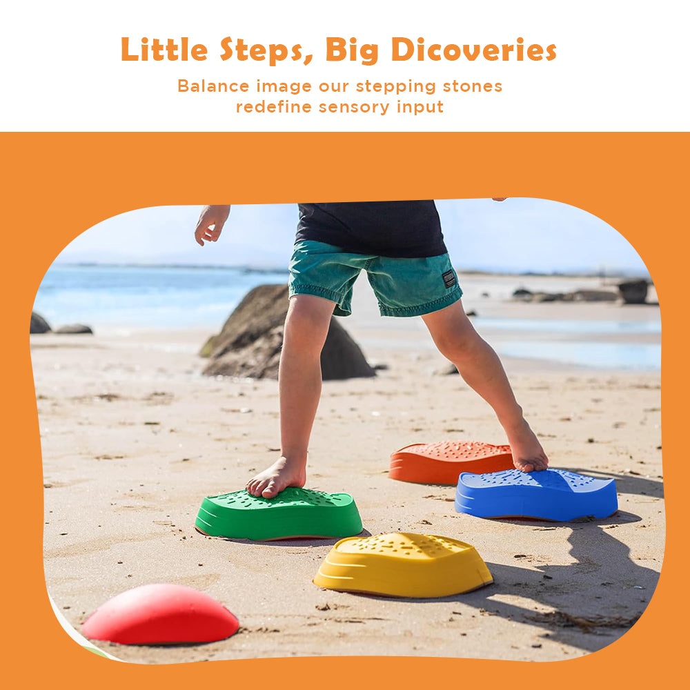 Child balancing on colorful Ableys sensory stepping stones for kids on sandy beach textured balance stones