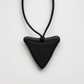 Black triangular silicone chewable necklace for sensory needs by Ableys on adjustable black cord
