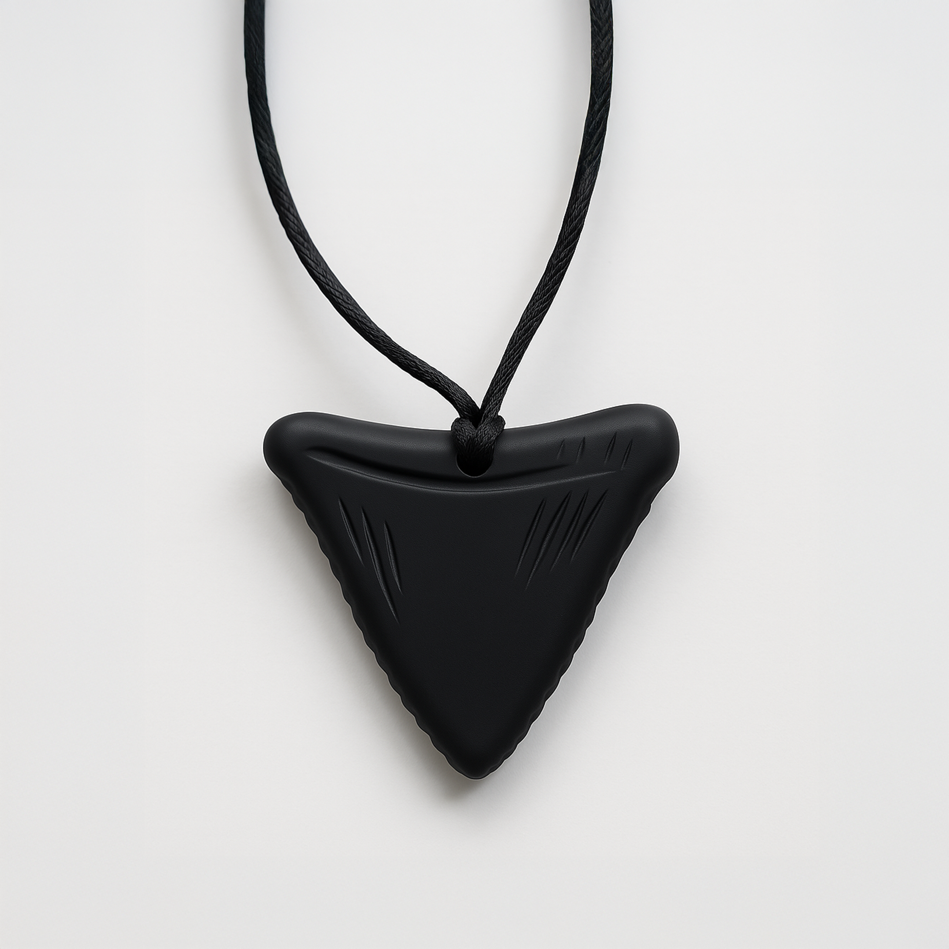 Black triangular silicone chewable necklace for sensory needs by Ableys on adjustable black cord
