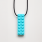 Ableys turquoise silicone building block pendant on black cord chewable necklace for sensory needs