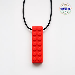 Ableys red silicone building block pendant on black cord chewable necklace for sensory needs durable textured teether