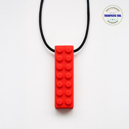 Ableys red silicone building block pendant on black cord chewable necklace for sensory needs durable textured teether