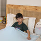 Ableys compression bed sheet for sensory needs light blue calming fitted sheet on child in bed
