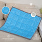 Ableys blue quilted weighted lap pad for focus on couch with gray trim and textured pockets