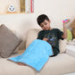 Ableys blue sensory weighted lap pad for focus on child seated on couch using calming fidget toy